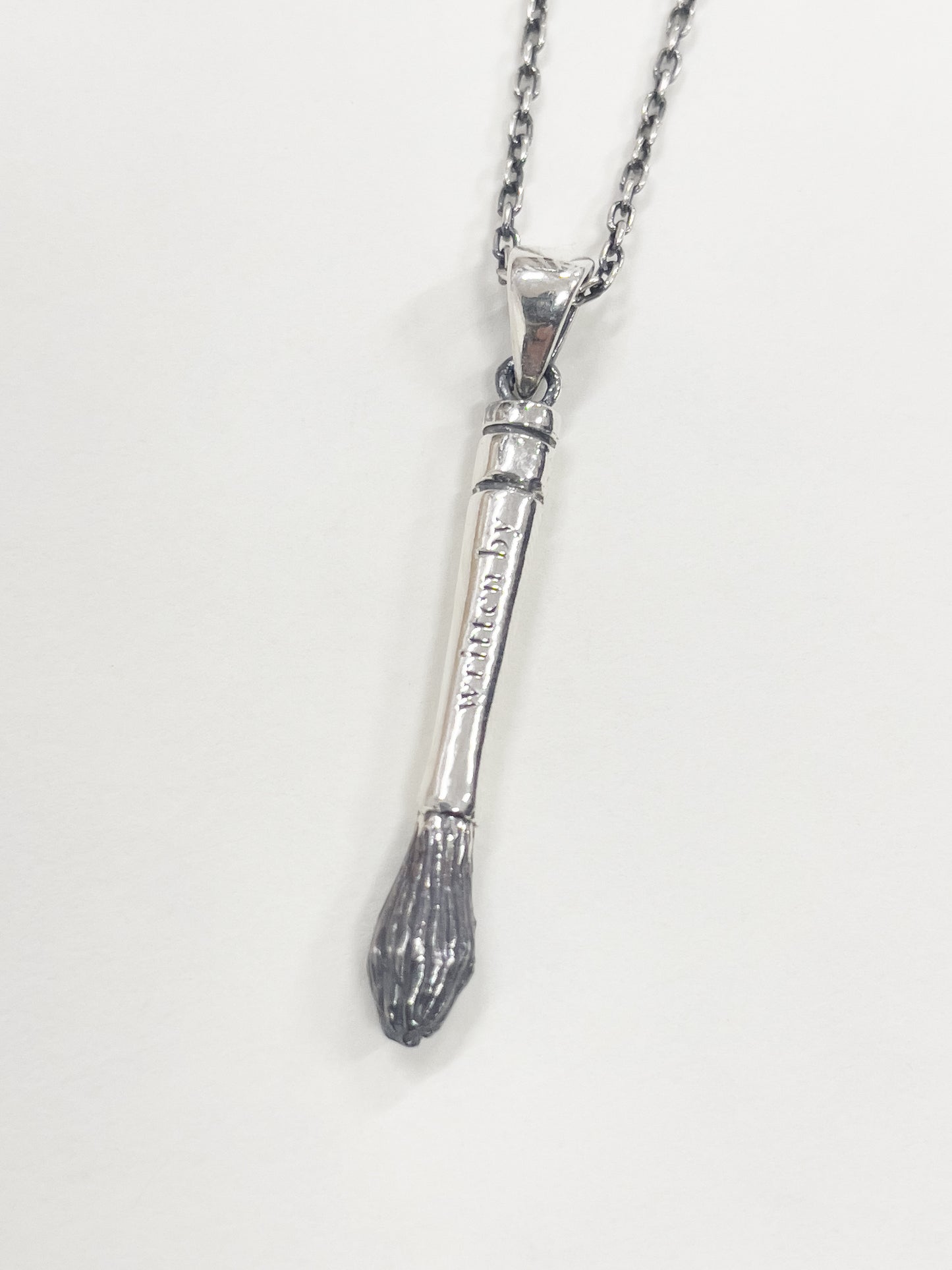 brush charm necklace